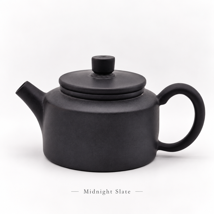 Midnight Slate #12, cleaned front view of the 80 ml Jianshui Little Drum teapot, with subtitle
