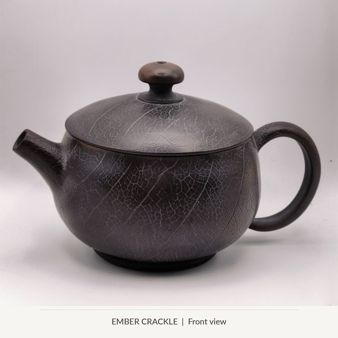 Ember Crackle, front view of Master Zhu's 100 ml Jianshui solo teapot with crackled clay texture