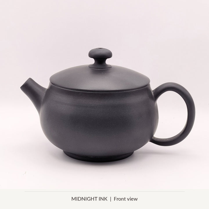 Midnight Ink, front view of Master Zhu's 100 ml Jianshui round solo gongfu teapot, smooth dark charcoal finish
